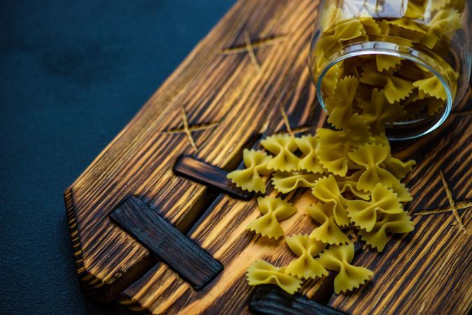 Raw bowtie pasta on board