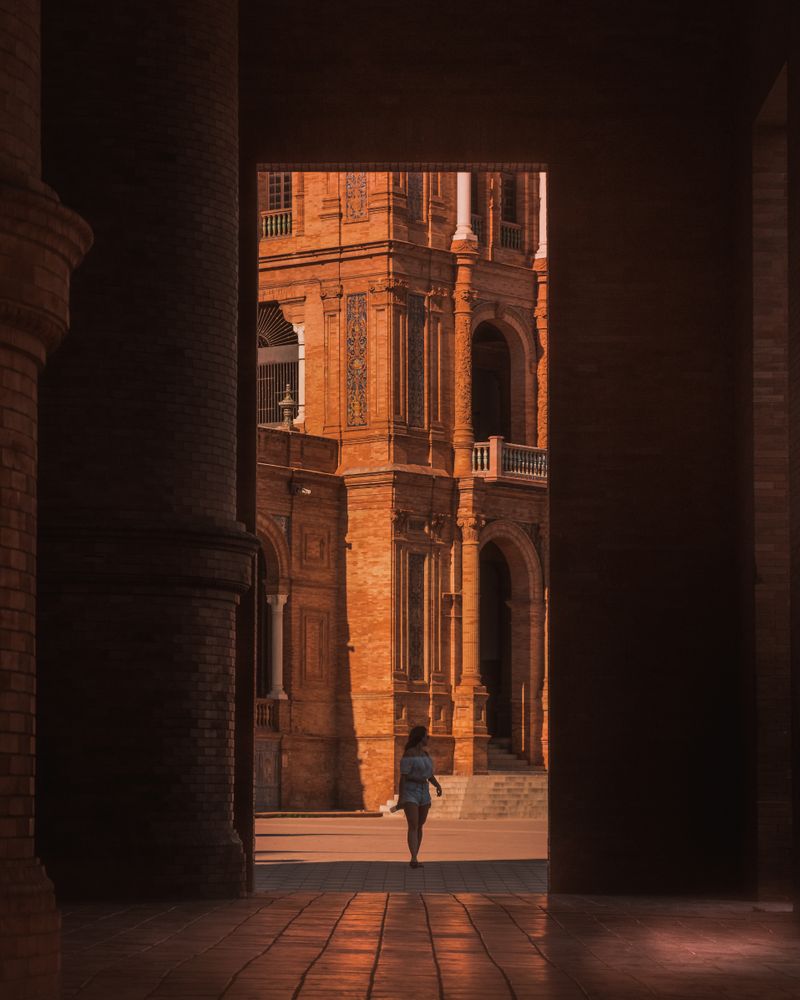Woman walks near buildings