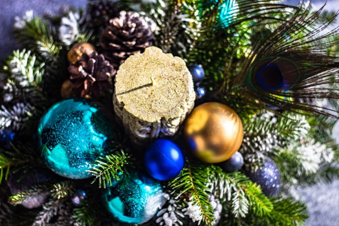 Top view of blue and gold Christmas baubles in pine centerpiece