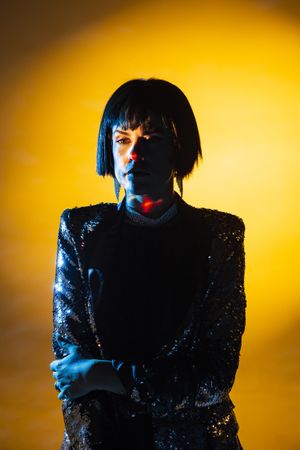 Stylish woman singing on stage