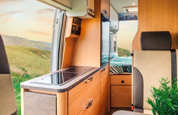Inside of motorhome camper with door open to scenic view
