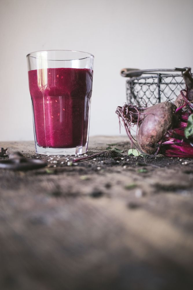 Beetroot and fresh smoothie on wooden table