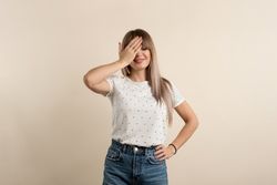 woman posing in pastel background
