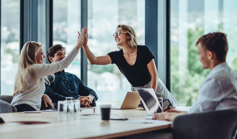Woman CEO giving thanks to female colleague
