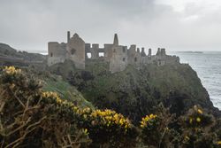 Ruins of medieval castle on cliff in Northern Ireland