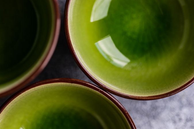 Close up of round geometric green bowls