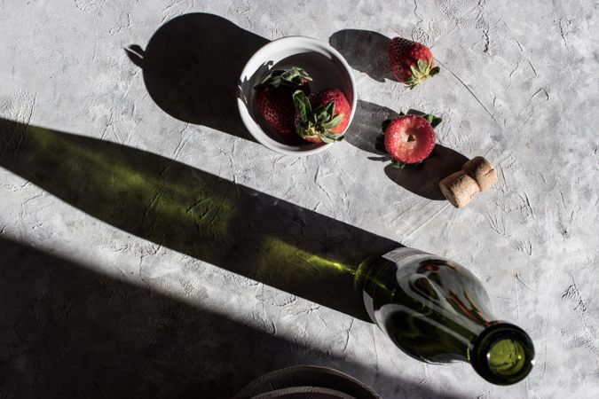 Strawberries near bottle of drink