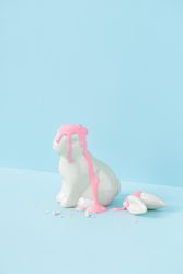 Easter bunny with broken ears on blue background and baby pink blood
