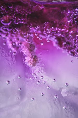 Ice with lilac colored tonic