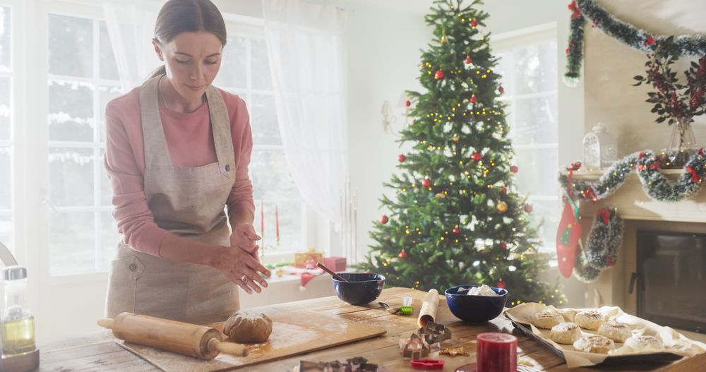 Portrait of Female Chef Preparing Dough and Making Gingerbread for Christmas at Home.