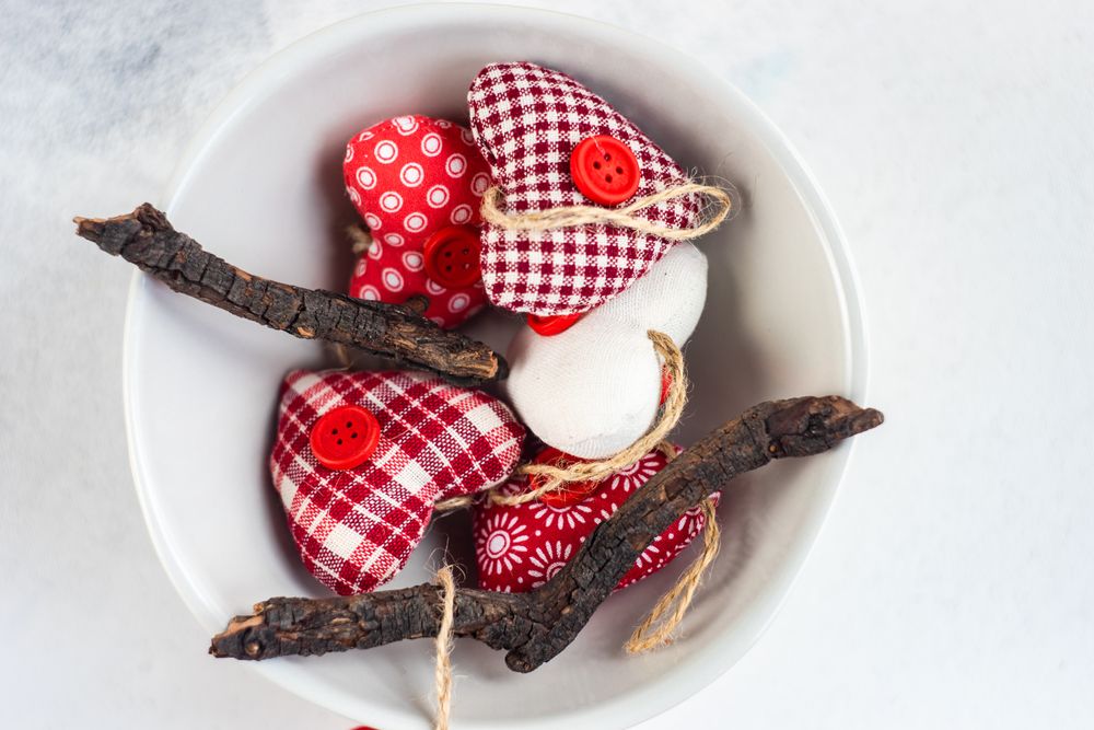 St. Valentines Day concept with bowl of felt heart decorations
