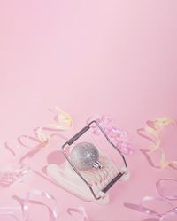 Sparkly silver Christmas ornament in egg cutter with ribbons