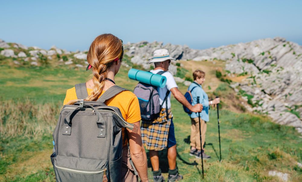 Back of hikers descending a hill