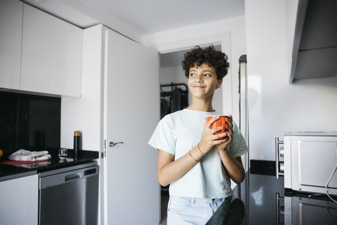 Girl drinking a cup of milk