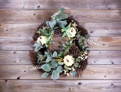 Autumn holiday wreath on rustic wood