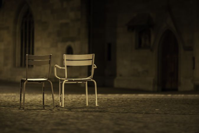 Two empty chairs in street