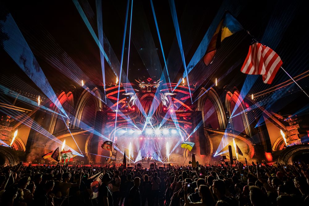 Back view of audience watching concert at night
