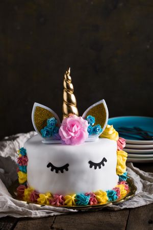 Cute unicorn cake with painted closed eyes