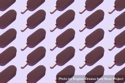 Multiple chocolate popsicles in diagonal rows on lavender background 5w9pyb