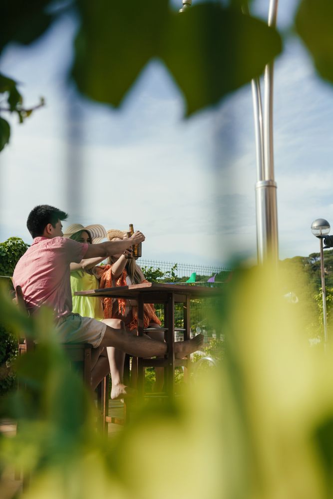 Group of friends drinking beer on the terrace