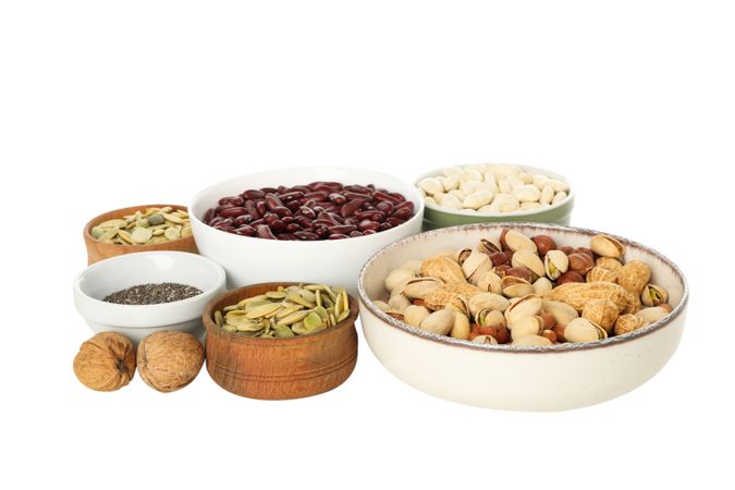 Set of protein vegan products in bowls, isolated on plain background