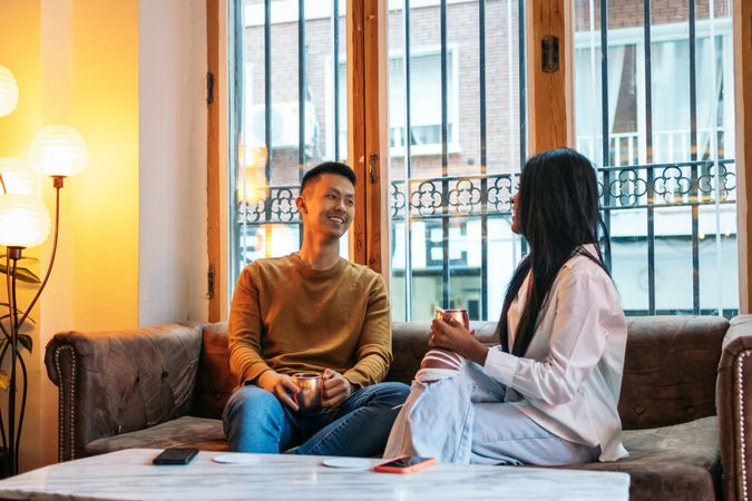 Asian man and Black Latina woman on a date