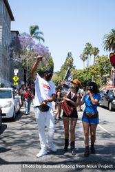 Los Angeles, CA, USA — June 14th, 2020: people walk down city street in Hollywood at protest 5r9720