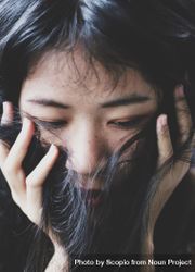 Portrait of woman covering her face with her hair 41kRL0