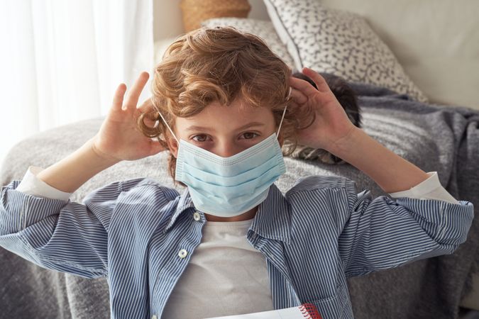 Calm boy in medical mask during COVID19 pandemic