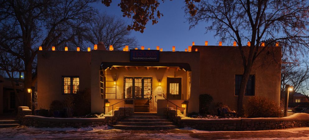 The Tesoros Trading Company gift shop at dusk on Christmas Eve in the Old Town district of Santa Fe