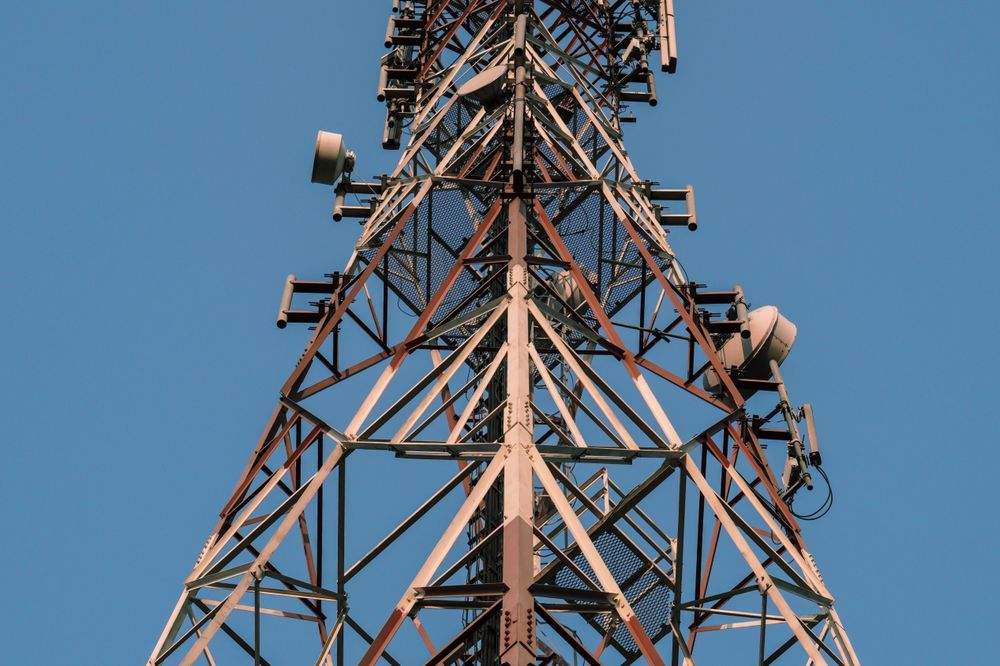 Tall Communications Tower Against a Clear Blue Sky