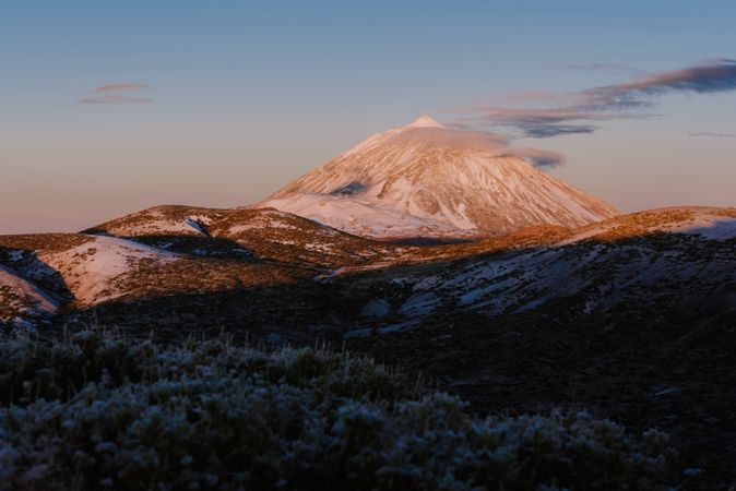 Clouds near snowy mountain