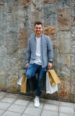 Young man with shopping bags