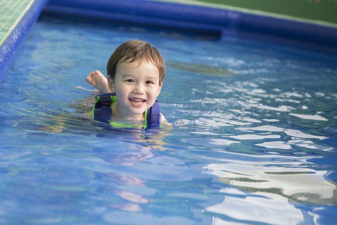 Biracial Happy Boy Playing at the Water Park