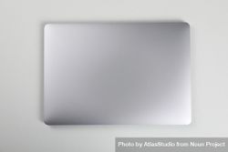 Top view of closed silver laptop on desk 0Ko3D0
