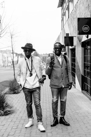 Full length shot of two young men in fashionable outfits