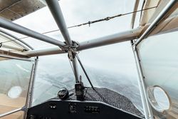 Aerial view from inside the cockpit of a small plane