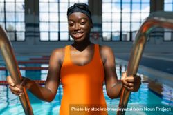 Black woman coming out of the swimming pool 4266a7