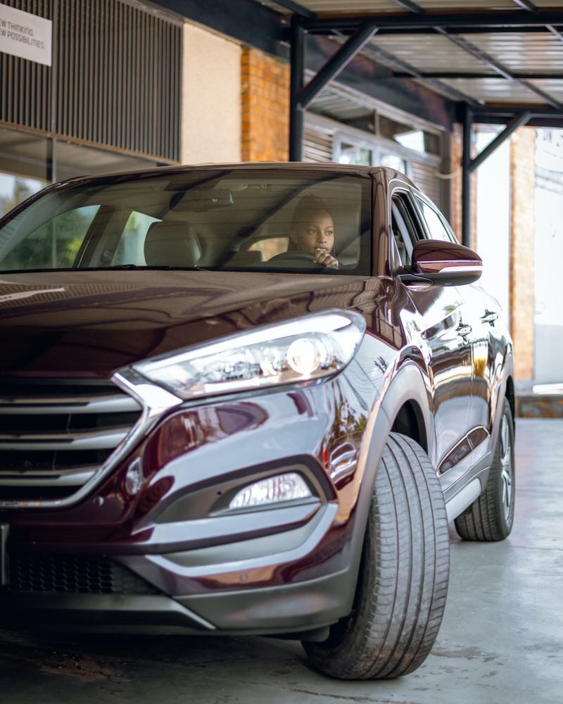 Burgundy Honda SUV in garage