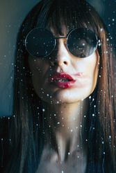 Stylish woman kissing glass