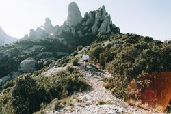 Man running on rocky path