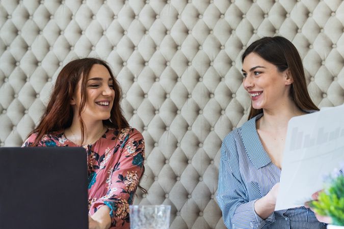 Focused women working on laptops in coworking space