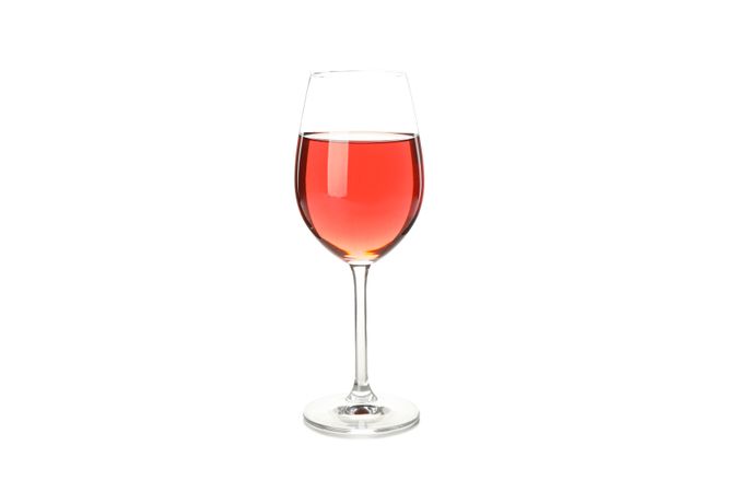 Glass with pink wine isolated on plain background