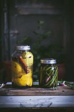 Glass jar with preserved yellow and green vegetables