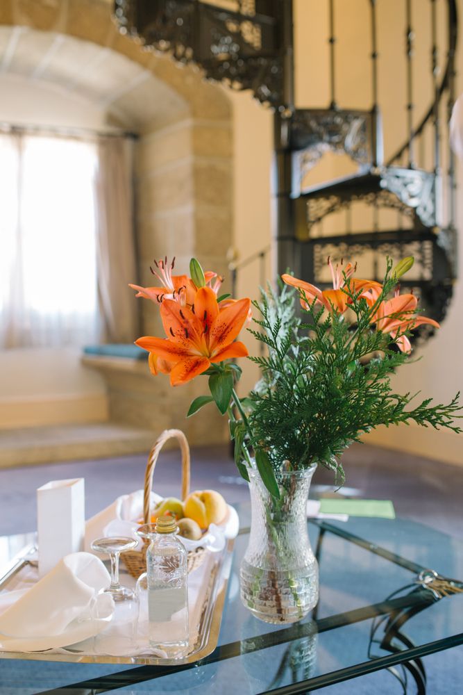 Bouquet and tray on table in hotel room