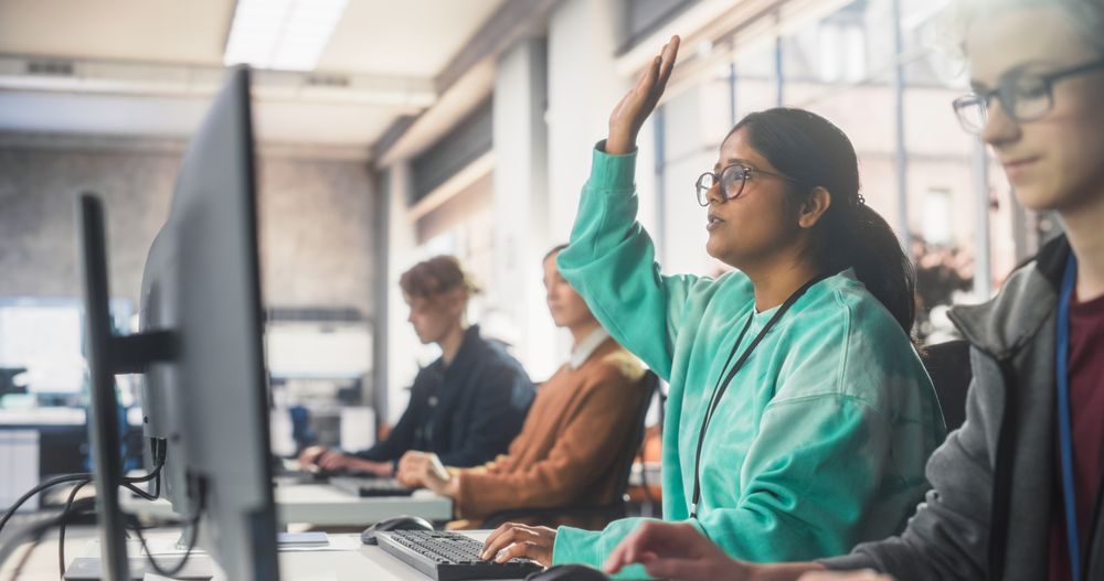 Young Indian Female Student Studying in University with Diverse Multiethnic Classmates.