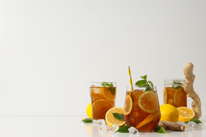 Cold tea with fresh oranges and mint leaves