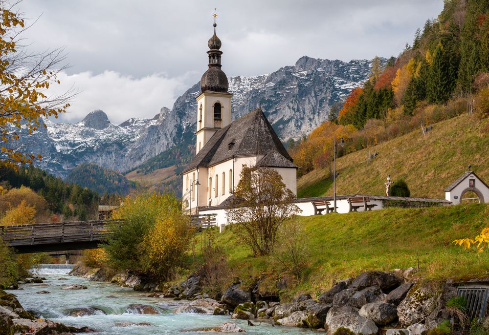 St. Sebastian church in an autumn scenery in the Bavarian Alps, Germany