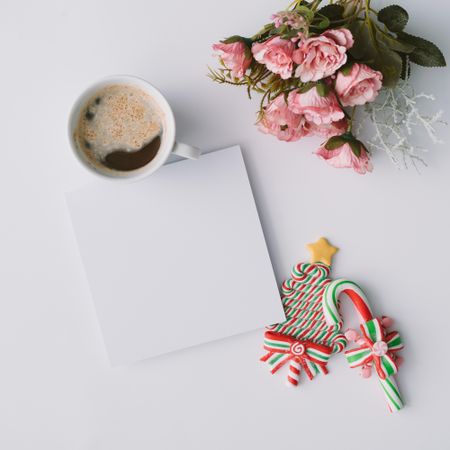 Coffee, candy, and paper card with flowers