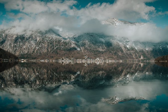 Perfect turquoise lake reflecting cloudy sky